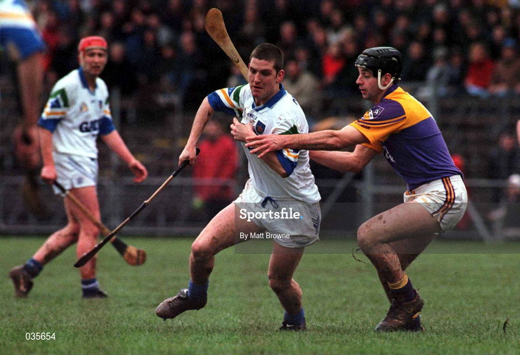 27 February 2000; Ken McGrath of Waterford is tackled by Darragh Ryan of Wexford during the Church & General National Hurling League Division 1B Round 2 match between Waterford and Wexford at Walsh Park in Waterford. Photo by Matt Browne/Sportsfile
