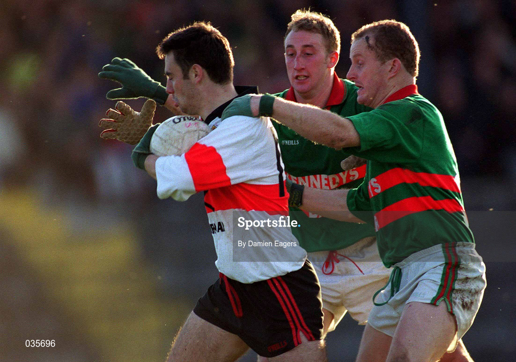 20 November 1999; Franny Halpin of UCC in action against Jason Crotty and Dan Crotty, right, of Rathgormack during the AIB Munster Senior Club Football Championship Semi-Final match between Rathgormack and UCC at Páirc Uí Rinn in Cork. Photo by Damien Eagers/Sportsfile