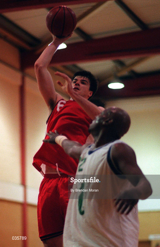7 November 1999. Greg Haffner of Tolka Rovers shoots under pressure from Roscoe Patterson of Waterford Crystal during the ESB Men's Superleague Basketball match between Tolka Rovers and Waterford Crystal at Griffith Avenue in Dublin. Photo by Brendan Moran/Sportsfile