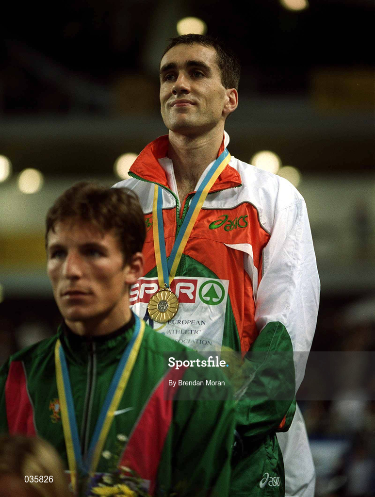 27 February 2000; Mark Carroll of Ireland stands with his gold medal, behind Rui Silva of Portugal, for the playing of the National Anthems during the European Indoor Athletics Championships at Flanders Sports Arena in Ghent, Belguim. Photo by Brendan Moran/Sportsfile