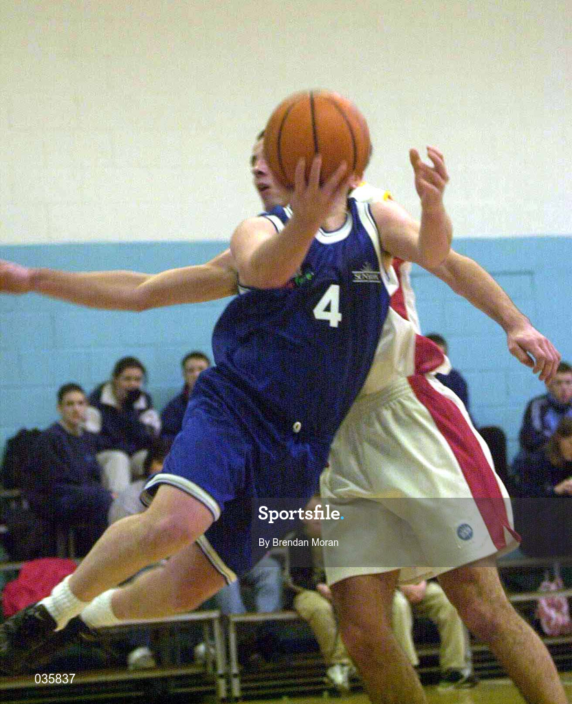 4 December 1999. Mark Keenan of St Vincent's in action against John Galvin of BK Limerick during the ESB Men's Superleague Basketball match between St Vincent's and BK Limerick at St Vincent's Basketball Club in Glasnevin, Dublin. Photo by Brendan Moran/Sportsfile