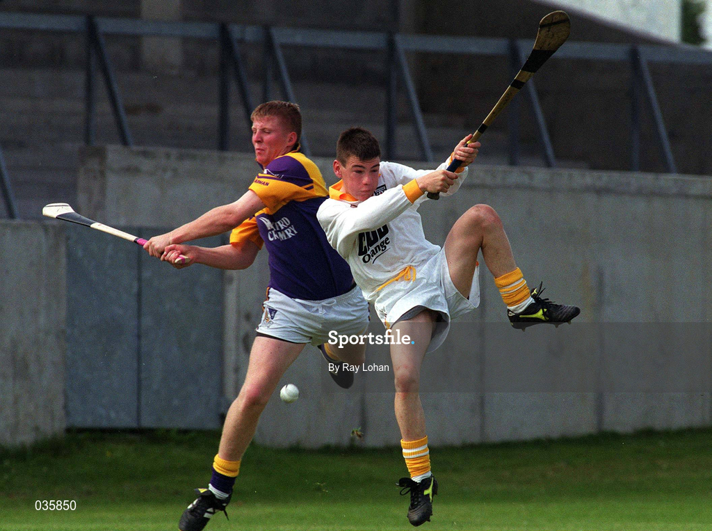 24 July 1999; Leon O'Connell of Wexford in action against Gareth Magee of Antrim during the All-Ireland Minor Hurling Championship Quarter-Final match between Antrim and Wexford at Parnell Park in Dublin. Photo by Ray Lohan/Sportsfile