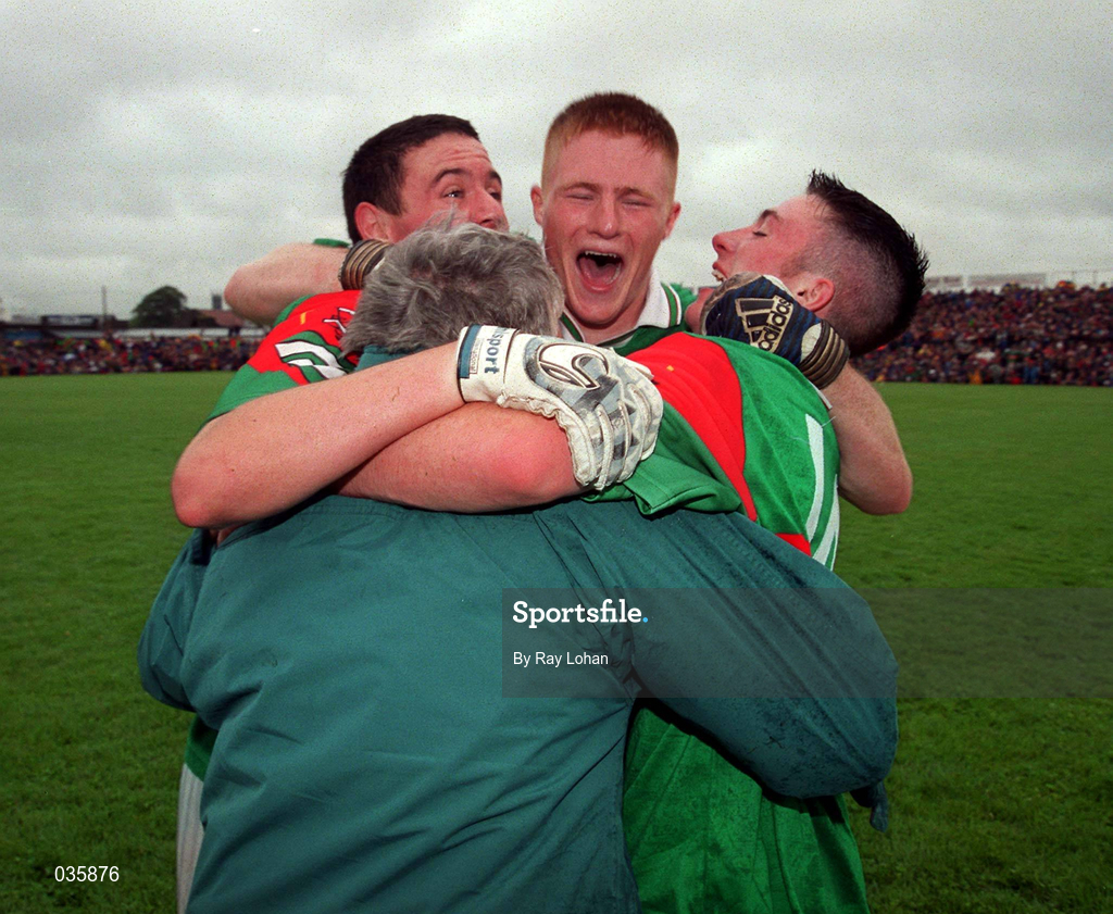 18 July 1999; Mayo players celebrate with a fan after the Connacht Minor Football Championship Final match between Galway and Mayo at Tuam Stadium in Galway. Photo by Ray Lohan/Sportsfile