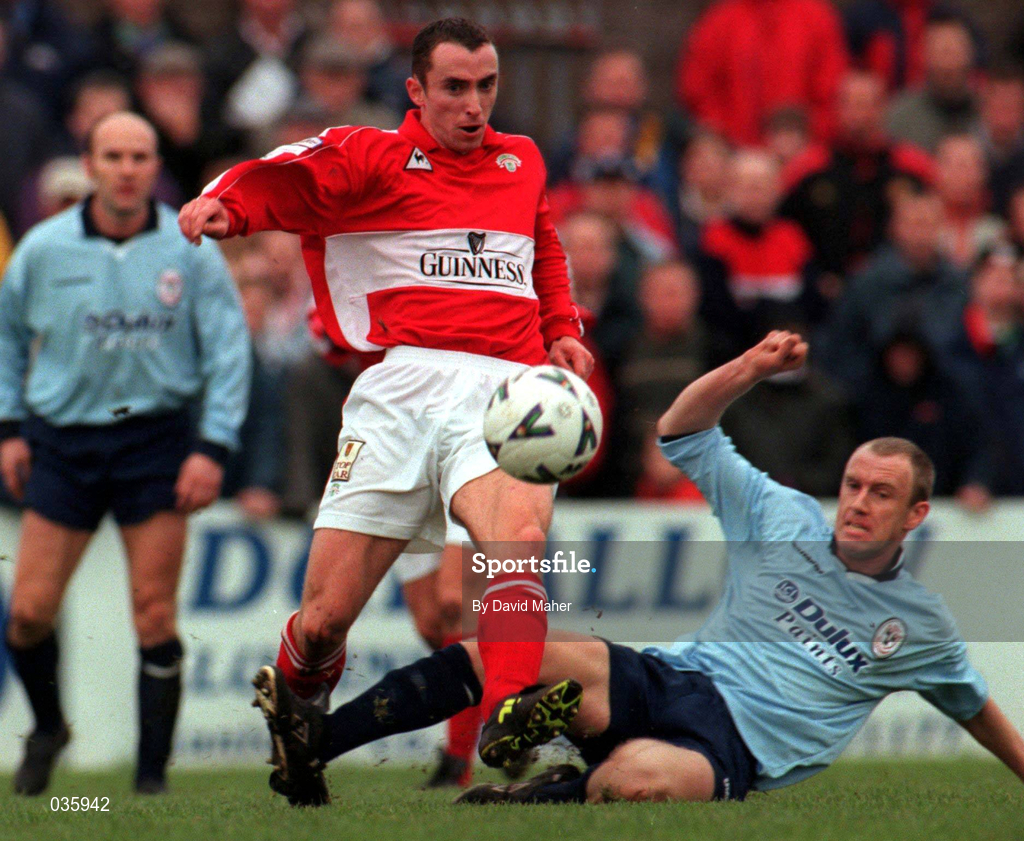 5 December 1999; Ollie Cahill of Cork City is tackled by Tony McCarthy of Shelbourne during the Eircom League Premier Division match between Cork City and Shelbourne at Turners Cross in Cork. Photo by David Maher/Sportsfile