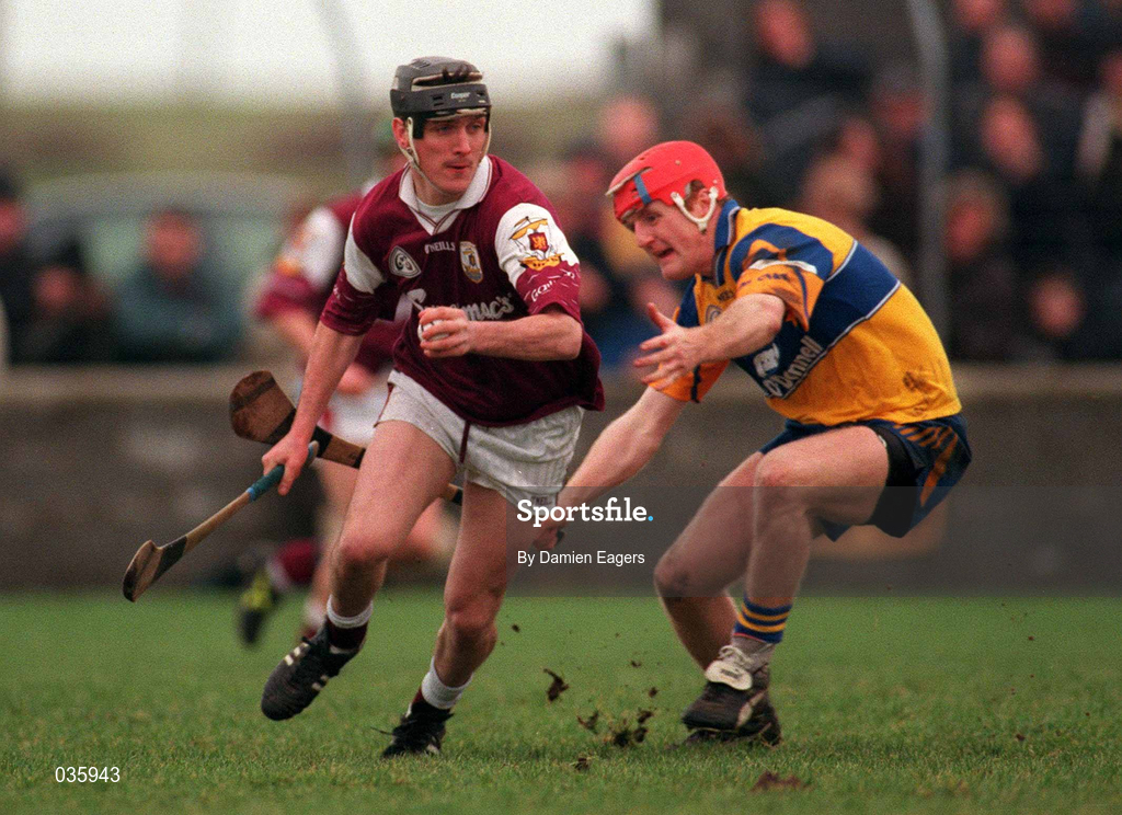 27 February 2000; Ollie Fahy of Galway in action against Brian Lohan of Clare during the Church & General National Hurling League Division 1A Round 2 match between Clare and Galway at Hennessy Park in Miltown Malbay, Clare. Photo by Damien Eagers/Sportsfile