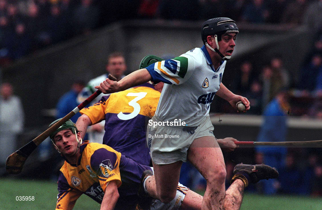27 February 2000; Paul Flynn of Waterford in action against Donal Berry, 3, and Declan Ruth of Wexford during the Church & General National Hurling League Division 1B Round 2 match between Waterford and Wexford at Walsh Park in Waterford. Photo by Matt Browne/Sportsfile