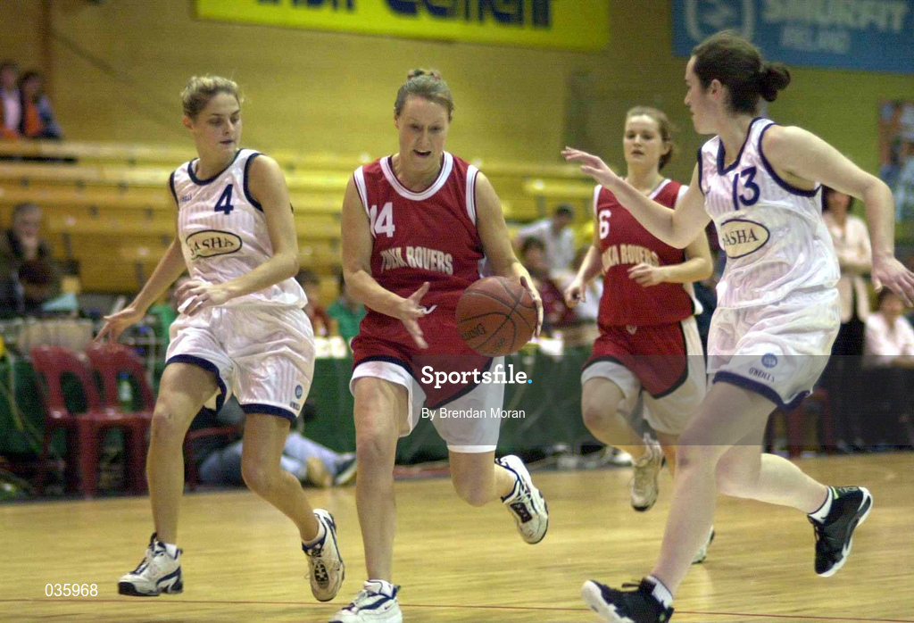 28 January 2000; Rachel Kelly of Tolka Rovers in action against Sinead Harvey, left, and Catherine O'Sullivan of Meteors during the Senior Women's Sprite Cup Semi-Final match between Tolka Rovers v Meteors at Tallaght Stadium in Dublin. Photo by Brendan Moran/Sportsfile