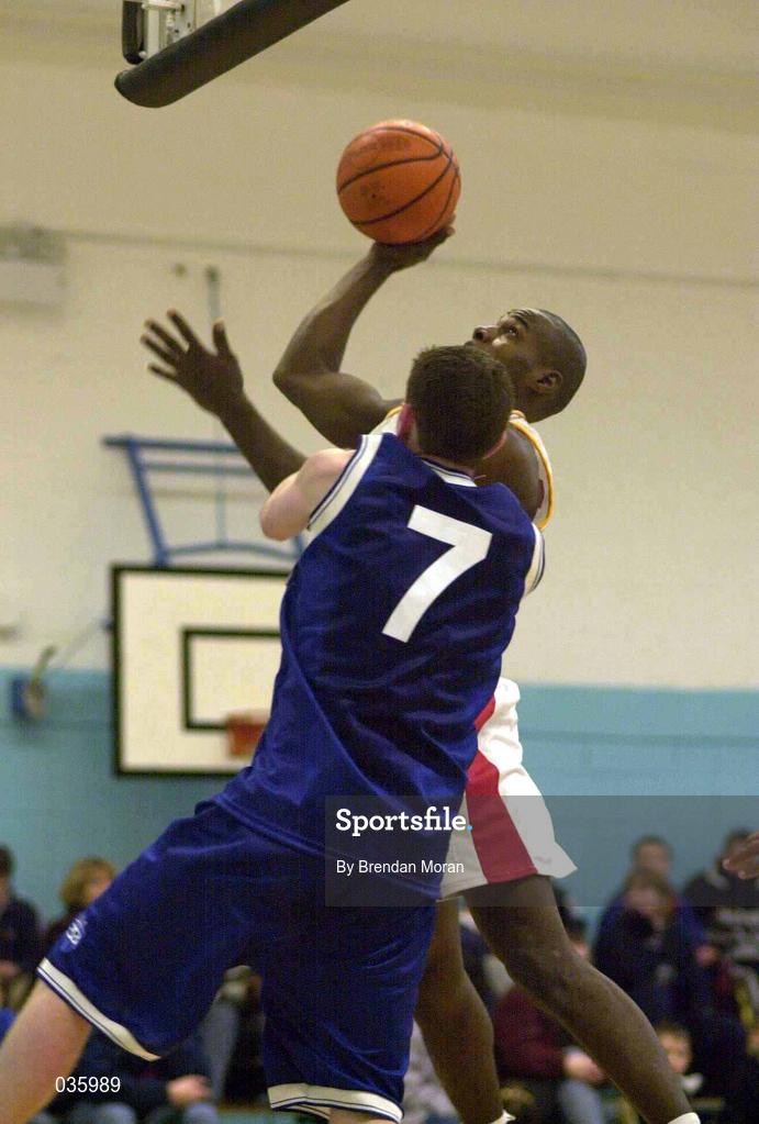 4 December 1999. Rock Winston of BK Limerick in action against Gerry Noone of St Vincent's during the ESB Men's Superleague Basketball match between St Vincent's and BK Limerick at St Vincent's Basketball Club in Glasnevin, Dublin. Photo by Brendan Moran/Sportsfile