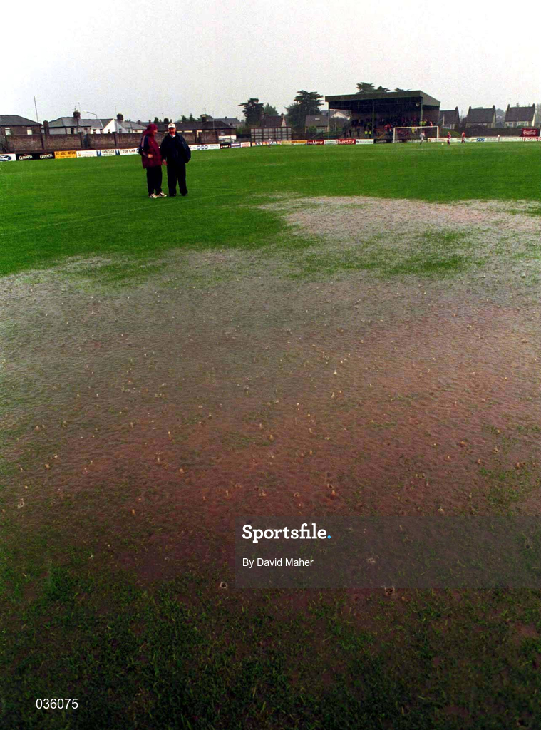 25 September 1999; Cork City manager Dave Barry, left, and UCD manager Theo Dunne share a joke after referee Hugh Byrne called off the game due to a waterlogged pitch. Eircom League Premier Division match between Cork City and UCD at Turners Cross in Cork. Photo by David Maher/Sportsfile