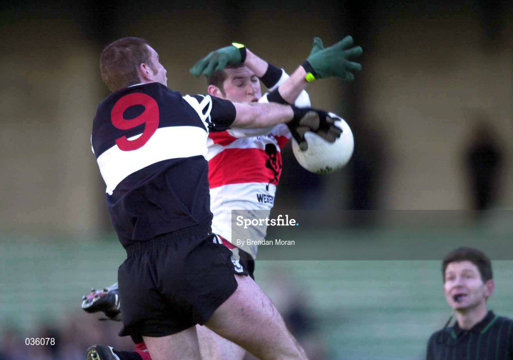12 December 1999; Micheál O'Sé of UCC in action against Senan Hehir of Doonbeg during the AIB Munster Senior Club Football Championship Final match between UCC and Doonbeg at the Gaelic Grounds in Limerick. Photo by Brendan Moran/Sportsfile