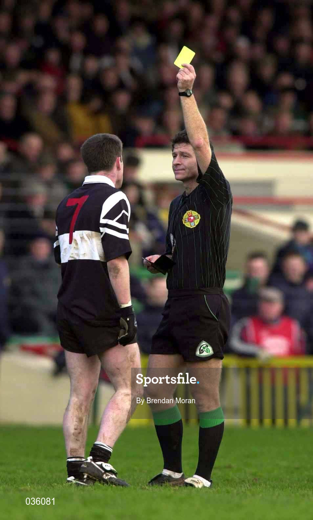 12 December 1999. Referee Brian White shows a yellow card to Philip Smith of Doonbeg during the AIB Munster Senior Club Football Championship Final match between UCC and Doonbeg at the Gaelic Grounds in Limerick. Photo by Brendan Moran/Sportsfile