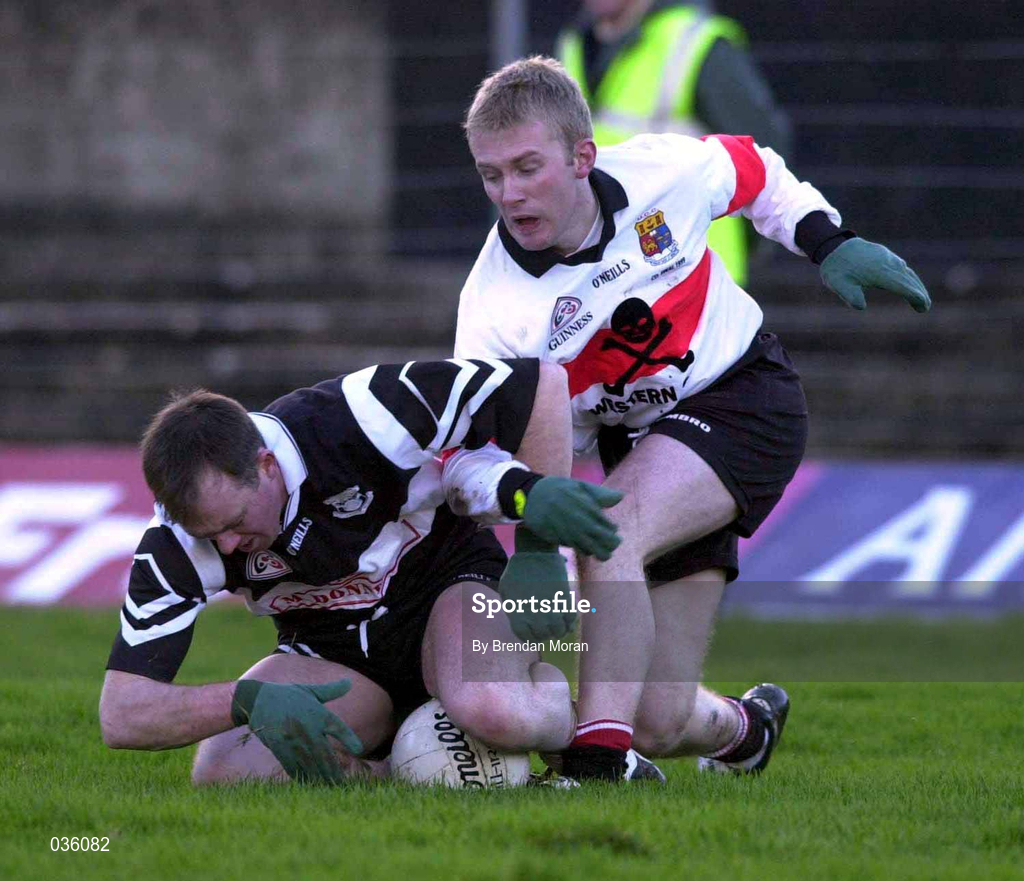 12 December 1999; Kieran O'Mahony of Doonbeg in action against Michael D Cahill of UCC during the AIB Munster Senior Club Football Championship Final match between UCC and Doonbeg at the Gaelic Grounds in Limerick. Photo by Brendan Moran/Sportsfile