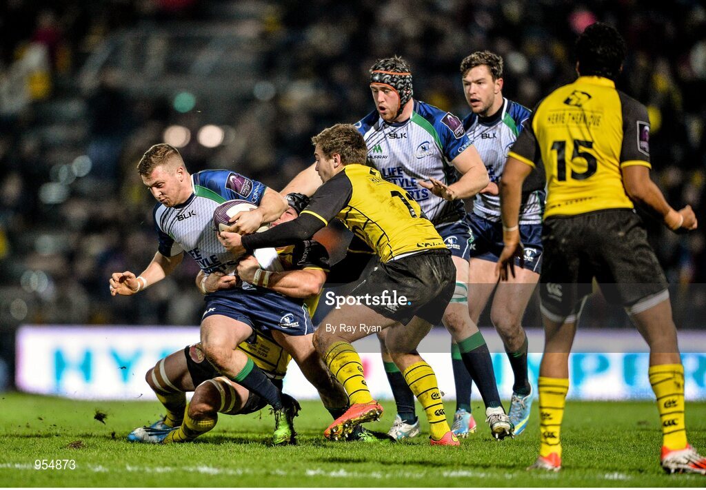 24 January 2015; Jack Carty, Connacht, is tackled by Charles Bouldoire and Nicolas Djebaiu, La Rochelle. European Rugby Champions Cup 2014/15, Pool 2, Round 6, La Rochelle v Connacht, Stade Marcel Deflandre, La Rochelle, France. Picture credit: Ray Ryan / SPORTSFILE