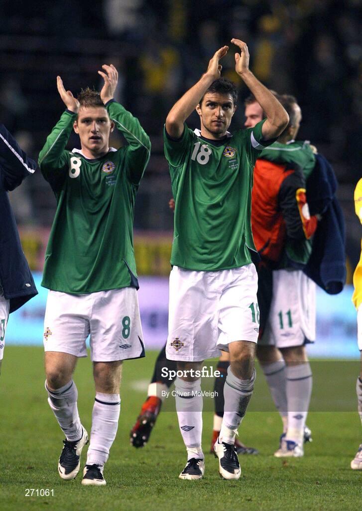 17 October 2007; Northern Ireland's Steve Davis, left,  and Aaron Hughes applaud the crowd of travelling supporters after the game. 2008 European Championship Qualifier, Sweden v Northern Ireland, Rasunda Stadium, Solna, Stockholm, Sweden. Picture credit; Oliver McVeigh / SPORTSFILE