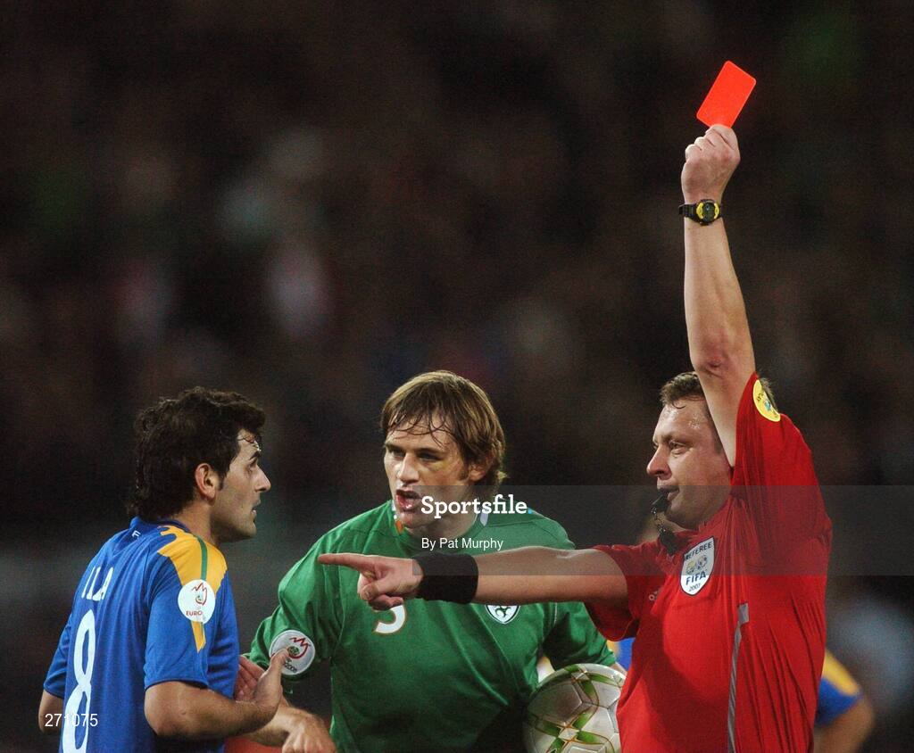 17 October 2007; Marios Ilia, Cyprus, is shown the red card by referee Mikko Vuorela, who is refereeing his last ever game, as Republic of Ireland's Kevin Kilbane looks on. 2008 European Championship Qualifier, Republic of Ireland v Cyprus, Croke Park, Dublin. Picture credit; Pat Murphy / SPORTSFILE