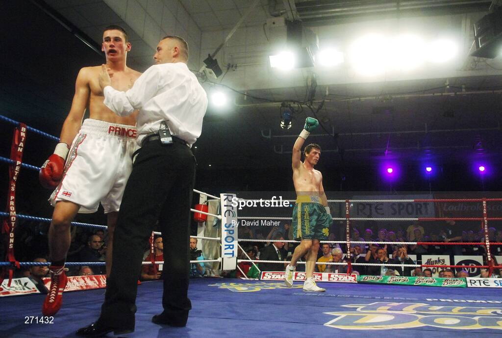 20 October 2007; Referee Emile Tiedt stops the fight in the second round as he counts out Prince Arron and John Duddy celebrates in the backfground. Hunky Dorys Fight Night, John Duddy v Prince Arron. National Stadium, Dublin. Picture credit; David Maher / SPORTSFILE