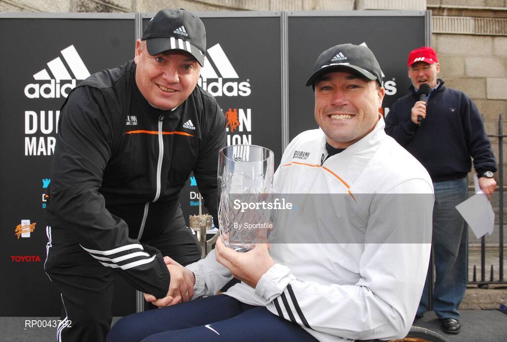 29 October 2007; Paul Moloney, Senior Sports Marketing Manager adidas, presents Richie Powell from Great Britan with the men's 1st place prize in the whellchair race. adidas Dublin City Marathon 2007, Merrion Square, Dublin. Photo by Sportsfile  *** Local Caption ***