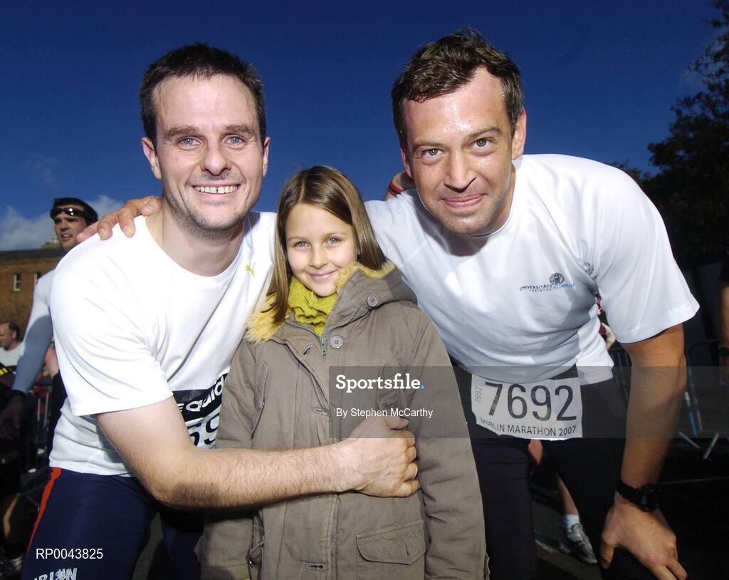 29 October 2007; John Dowling, left, celebrates finishing the marathon with daughter Fiona, age 8, and fellow participant Kia Swobada, from German. adidas Dublin City Marathon 2007, Merrion Square, Dublin. Picture credit: Stephen McCarthy / SPORTSFILE