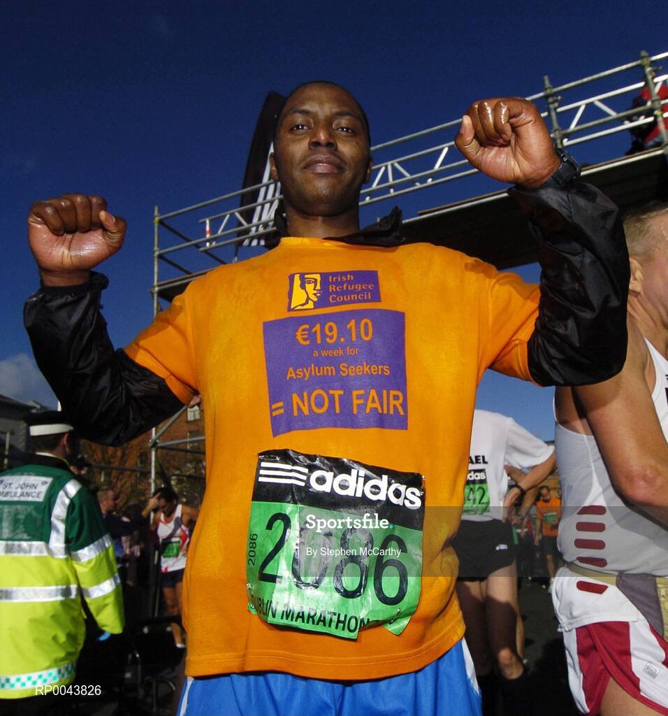 29 October 2007; Adam Kassiem, from Somalia, who was one of twenty Asylum Seeker taking part in the marthon, celebrates after crossing the line during the adidas Dublin City Marathon 2007, Merrion Square, Dublin. Picture credit: Stephen McCarthy / SPORTSFILE
