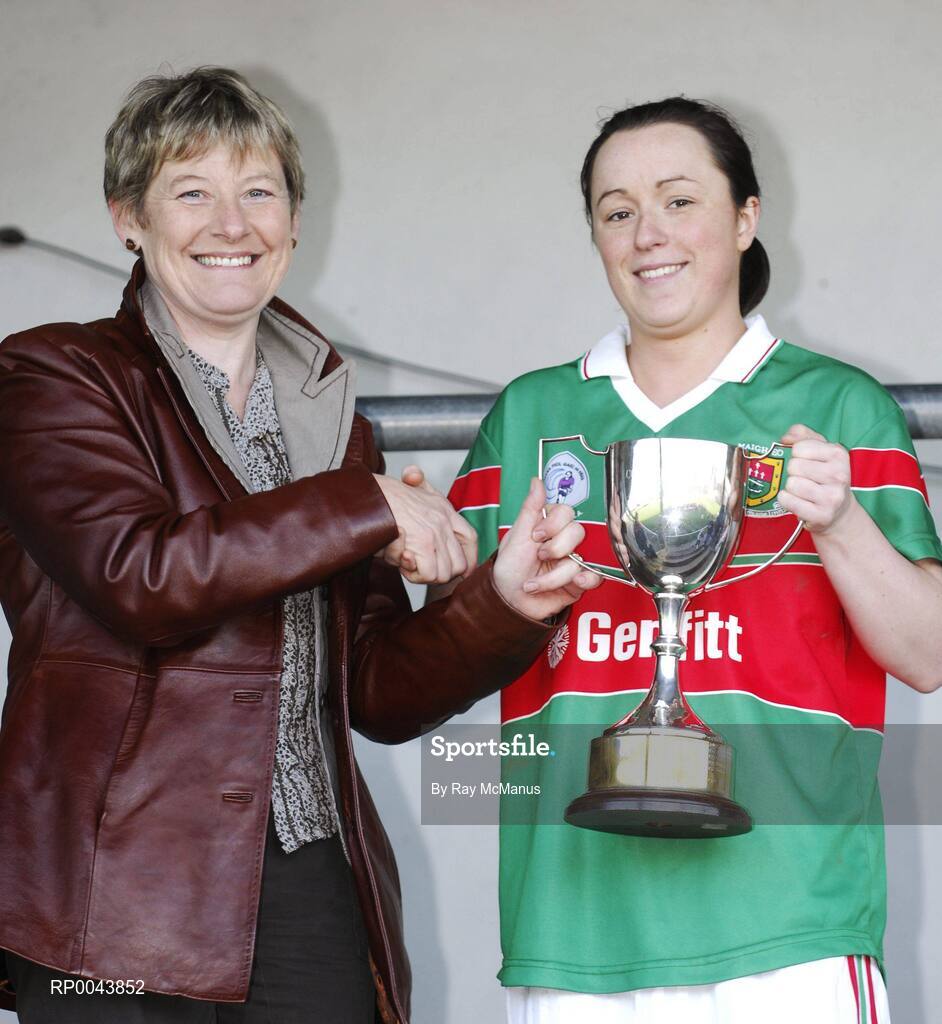 28 October 2007; The Carnacon captain Caroline McGing is presented with the cup by Mary Quinn, President, Connacht Council. VHI Healthcare Connacht Senior Club Football Championship Final, Corofin, Galway, v Carnacon, Mayo, GAA Grounds, Corofin, Galway. Picture credit: Ray McManus / SPORTSFILE