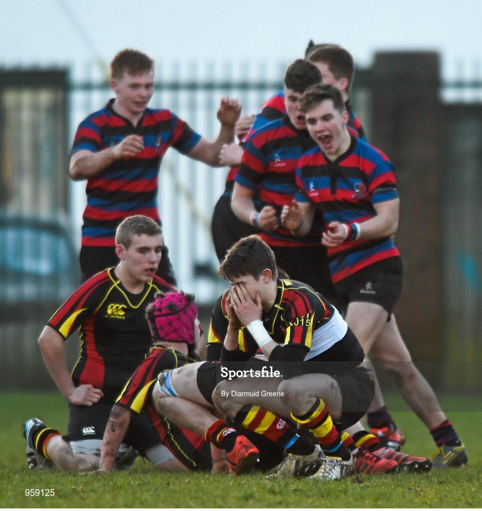 4 February 2015; Ardscoil Rís players, including Maurice Noonan, react at the final whistle as St Munchin's College players celebrate victory. SEAT Munster Schools Junior Cup, Round 1, St Munchin's College v Ardscoil Rís. St Mary's RFC, Limerick. Picture credit: Diarmuid Greene / SPORTSFILE