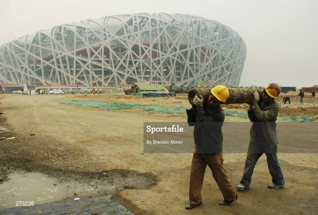 12 November 2007; Workers go about their business near the National Stadium during preparations in Beijing ahead of the 2008 Summer Olympic Games. The 2008 Summer Olympics, officially known as the Games of the XXIX Olympiad, will be take place from the 8th August 2008 to 24th August 2008, at the Beijing National Stadium in Beijing, China. Beijing, China. Picture credit: Brendan Moran / SPORTSFILE *** Local Caption ***