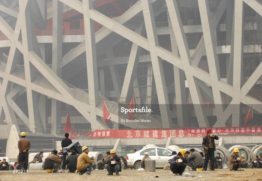 12 November 2007; Workers take a lunch break near the National Stadium during preparations in Beijing ahead of the 2008 Summer Olympic Games. The 2008 Summer Olympics, officially known as the Games of the XXIX Olympiad, will be take place from the 8th August 2008 to 24th August 2008, at the Beijing National Stadium in Beijing, China. Beijing, China. Picture credit: Brendan Moran / SPORTSFILE