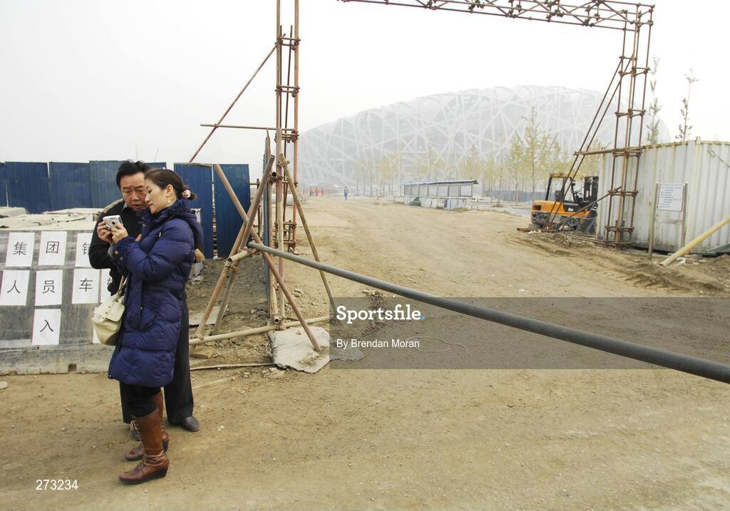 12 November 2007; Chinese tourists check their camera after taking a photo of the National Stadium during preparations in Beijing ahead of the 2008 Summer Olympic Games. The 2008 Summer Olympics, officially known as the Games of the XXIX Olympiad, will be take place from the 8th August 2008 to 24th August 2008, at the Beijing National Stadium in Beijing, China. Beijing, China. Picture credit: Brendan Moran / SPORTSFILE