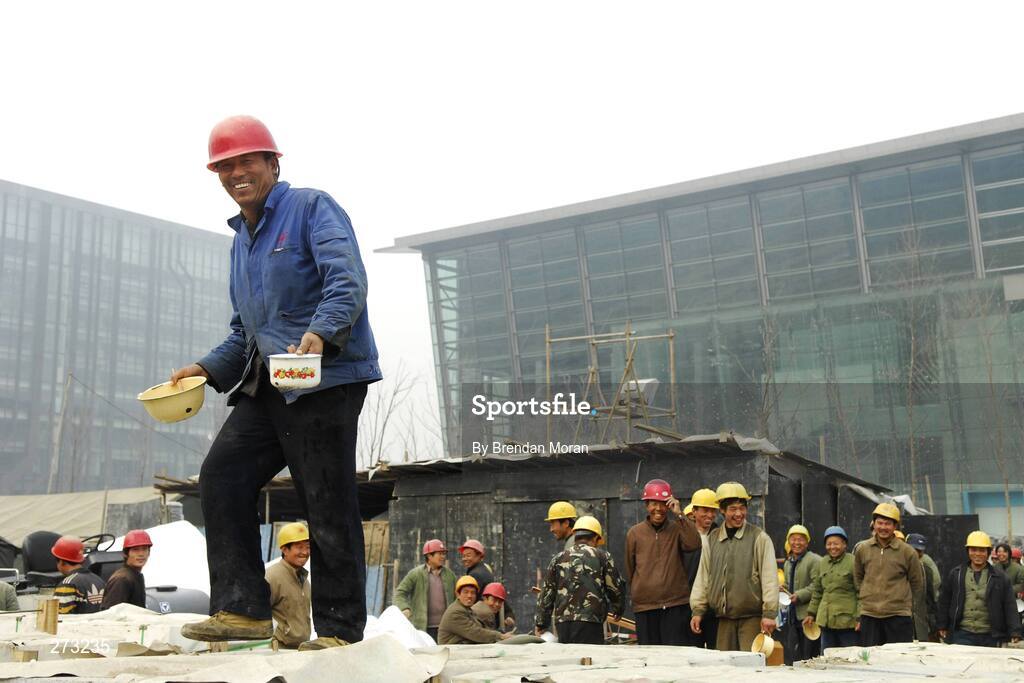 12 November 2007; Workers finish their lunch near the National Indoor Stadium during preparations in Beijing ahead of the 2008 Summer Olympic Games. The 2008 Summer Olympics, officially known as the Games of the XXIX Olympiad, will be take place from the 8th August 2008 to 24th August 2008, at the Beijing National Stadium in Beijing, China. Beijing, China. Picture credit: Brendan Moran / SPORTSFILE