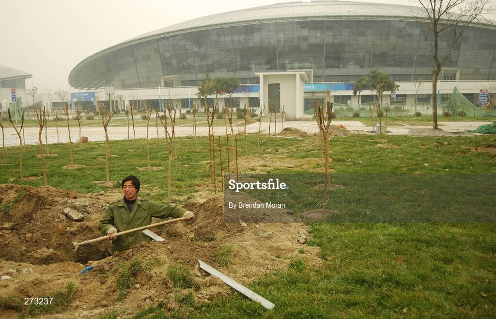 12 November 2007; A worker goes about his business near the Beijing University of Technology Gymnasium during preparations in Beijing ahead of the 2008 Summer Olympic Games. The 2008 Summer Olympics, officially known as the Games of the XXIX Olympiad, will be take place from the 8th August 2008 to 24th August 2008, at the Beijing National Stadium in Beijing, China. Beijing, China. Picture credit: Brendan Moran / SPORTSFILE *** Local Caption ***