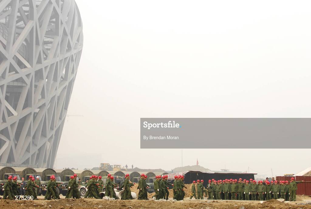 12 November 2007; Members of the Chinese Army march past the Narional Stadium, also known as the Bird's Nest, during preparations in Beijing ahead of the 2008 Summer Olympic Games. The 2008 Summer Olympics, officially known as the Games of the XXIX Olympiad, will be take place from the 8th August 2008 to 24th August 2008, at the Beijing National Stadium in Beijing, China. Beijing, China. Picture credit: Brendan Moran / SPORTSFILE *** Local Caption ***