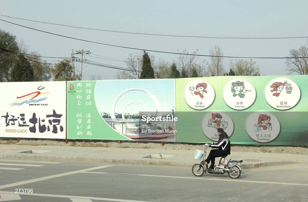 13 November 2007; A local travels past the Olympic Mascots for Beijing 2008 outside the Shunyi Olympic Rowing and Canoeing Park during preparations in Beijing ahead of the 2008 Summer Olympic Games. The 2008 Summer Olympics, officially known as the Games of the XXIX Olympiad, will be take place from the 8th August 2008 to 24th August 2008, at the Beijing National Stadium in Beijing, China. Beijing, China. Picture credit: Brendan Moran / SPORTSFILE *** Local Caption ***