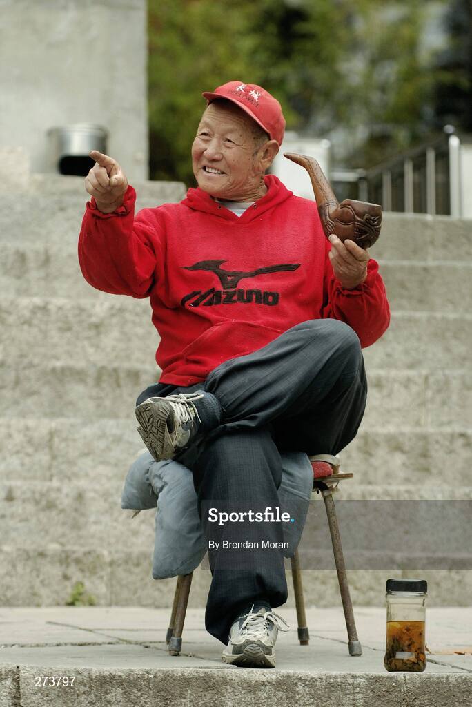 13 November 2007; A local man enjoys his pipe near the Great Wall of China at Mutianyu, during preparations in Beijing ahead of the 2008 Summer Olympic Games. The 2008 Summer Olympics, officially known as the Games of the XXIX Olympiad, will be take place from the 8th August 2008 to 24th August 2008, at the Beijing National Stadium in Beijing, China. Beijing, China. Picture credit: Brendan Moran / SPORTSFILE *** Local Caption ***