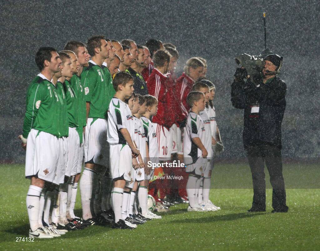 17 November 2007; The Northern Ireland and Denmark teams line up for the National Anthems in the heavy rain. 2008 European Championship Qualifier, Northern Ireland v Denmark, Windsor Park, Belfast, Co. Antrim. Picture credit; Oliver McVeigh / SPORTSFILE