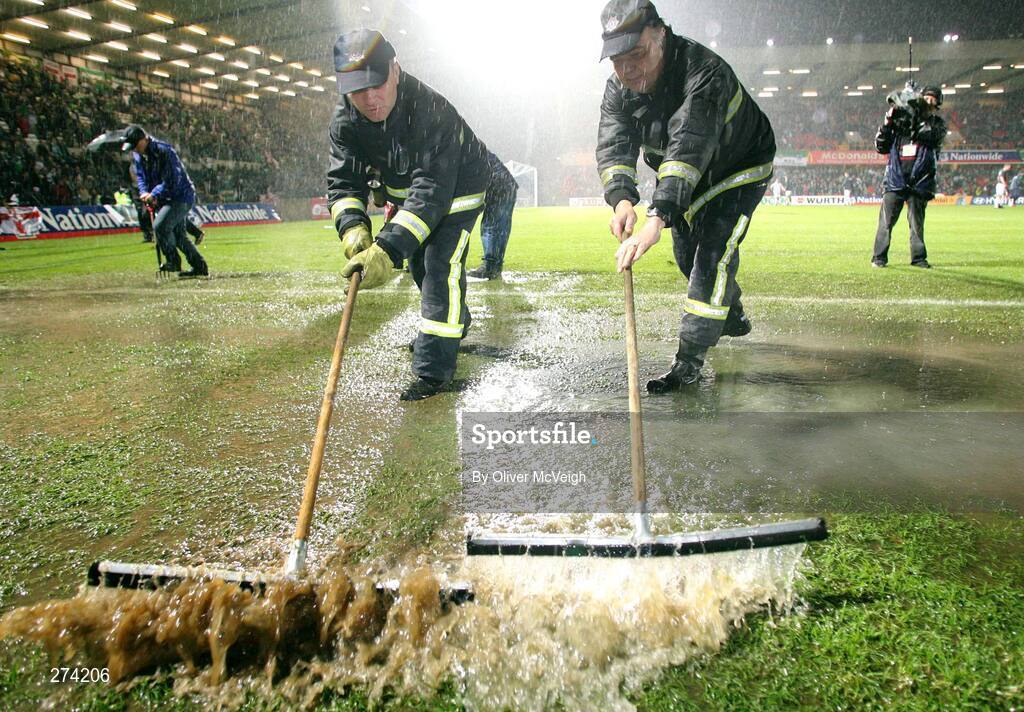 17 November 2007; Firemen clear the water off the pitch prior to the game. 2008 European Championship Qualifier, Northern Ireland v Denmark, Windsor Park, Belfast, Co. Antrim. Picture credit; Oliver McVeigh / SPORTSFILE
