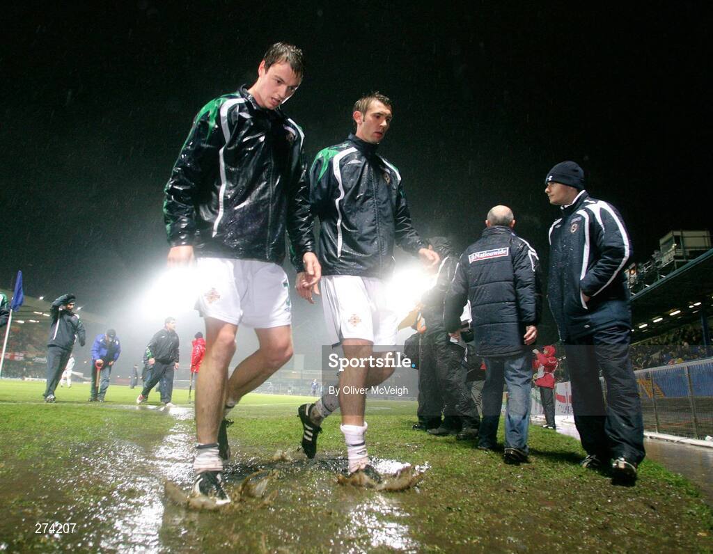 17 November 2007; Northern Ireland's Jonny Evans, left, and Gareth McAuley leave the field after the warm up in atrocious foot conditions. 2008 European Championship Qualifier, Northern Ireland v Denmark, Windsor Park, Belfast, Co. Antrim. Picture credit; Oliver McVeigh / SPORTSFILE