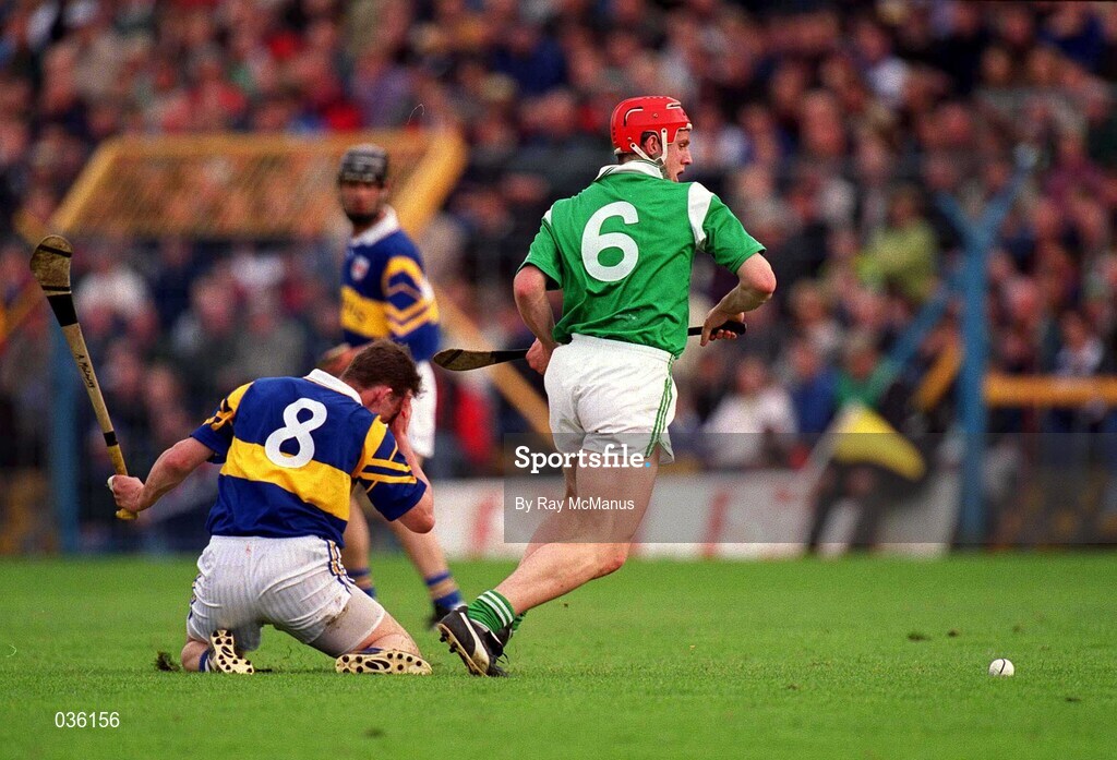 30 April 2000; Andy Moloney of Tipperary holds his face after a collision with Ollie Moran of Limerick during the Church & General National Hurling League Division 1 Semi-Final match between Tipperary and Limerick at Semple Stadium in Thurles, Tipperary. Photo by Ray McManus/Sportsfile