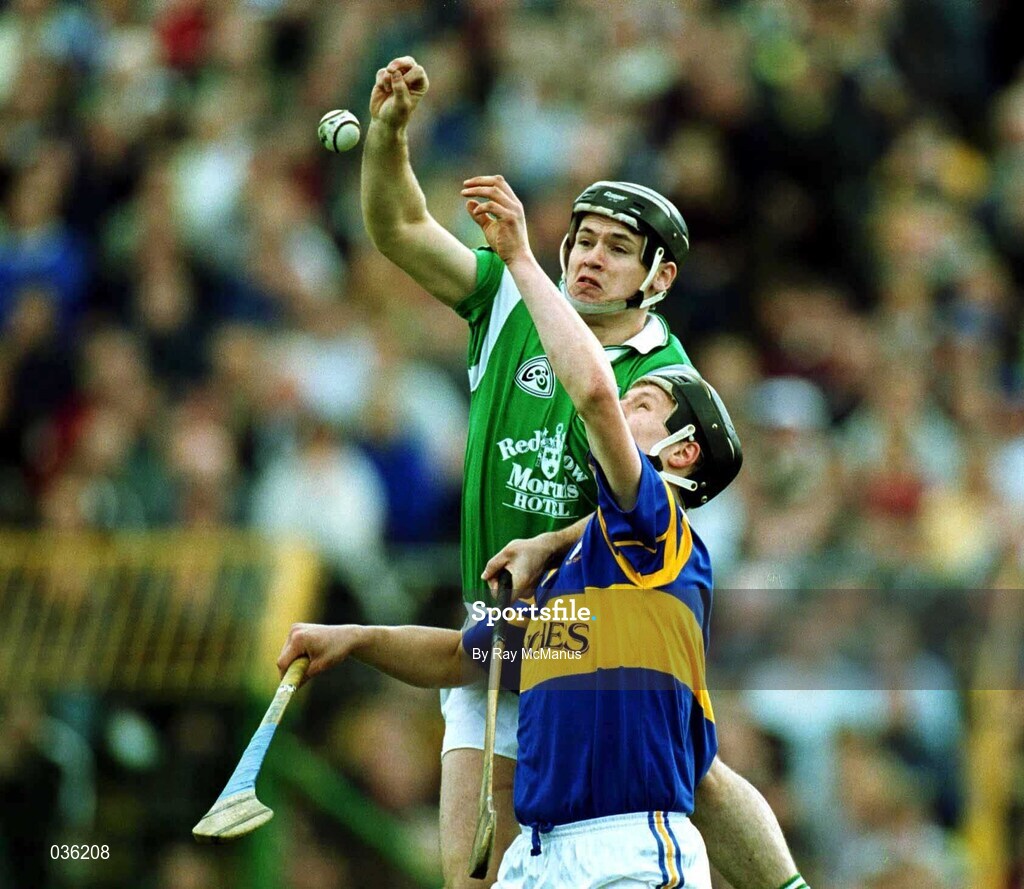 30 April 2000; Barry Foley of Limerick in action against Philip Maher of Tipperary during the Church & General National Hurling League Division 1 Semi-Final match between Tipperary and Limerick at Semple Stadium in Thurles, Tipperary. Photo by Ray McManus/Sportsfile