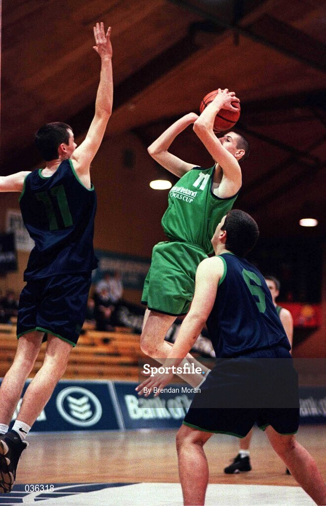 9 February 2000; Christopher O'Sullivan of Colaiste Mhuire Crosshaven shoots a basket over Shane Neary of Carrick-on-Shannon CS during the Bank of Ireland Schools Cup Boys' C Final match between Colaiste Mhuire Crosshaven and Carrick-On-Shannon CS at National Basketball Arena in Tallaght, Dublin. Photo by Brendan Moran/Sportsfile