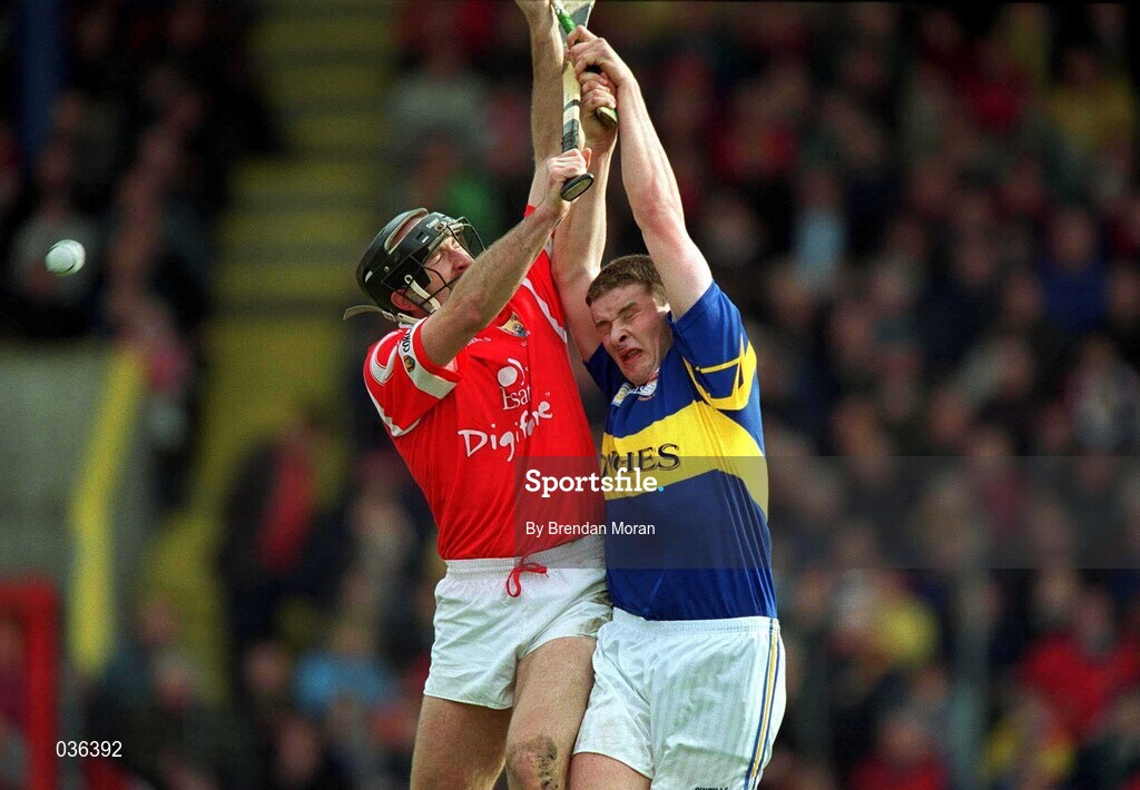 2 April 2000; Brian Corcoran of Cork in action against John O'Carroll of Tipperary during the Church & General National Hurling League Division 1B match between Cork and Tipperary at Páirc Uí Chaoimh in Cork. Photo by Brendan Moran/Sportsfile