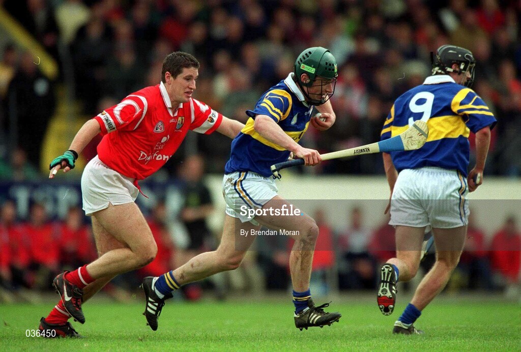2 April 2000; David Kennedy of Tipperary in action against Fergal McCormack of Cork during the Church & General National Hurling League Division 1B match between Cork and Tipperary at Páirc Uí Chaoimh in Cork. Photo by Brendan Moran/Sportsfile
