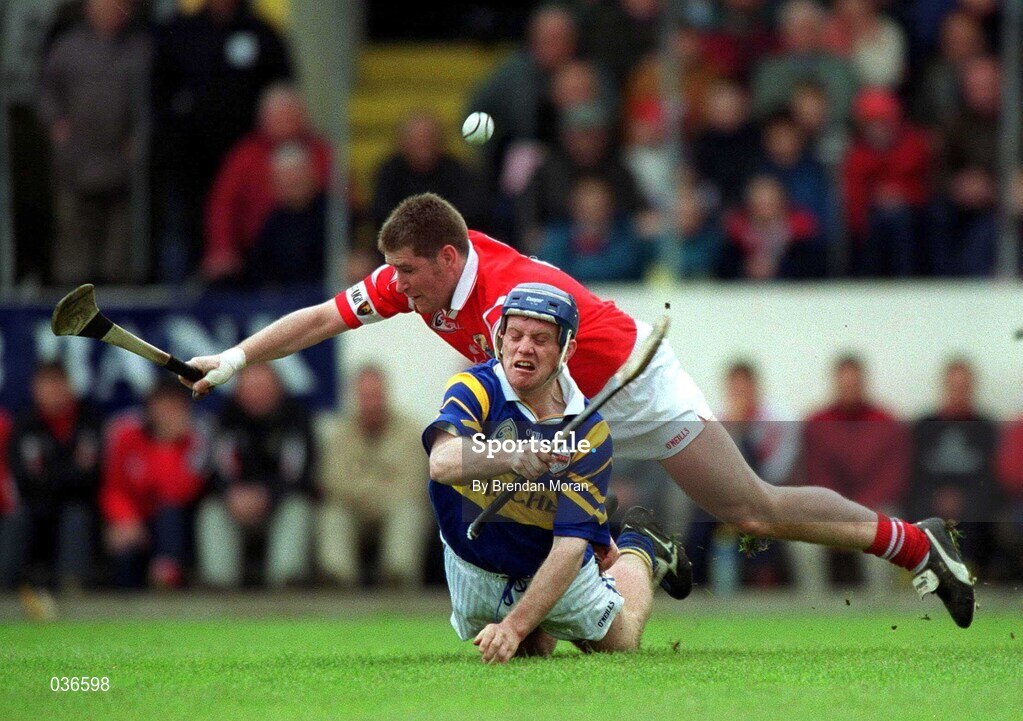 2 April 2000; Eugene O'Neill of  Tipperary in action against Mark Landers of Cork during the Church & General National Hurling League Division 1B match between Cork and Tipperary at Páirc Uí Chaoimh in Cork. Photo by Brendan Moran/Sportsfile