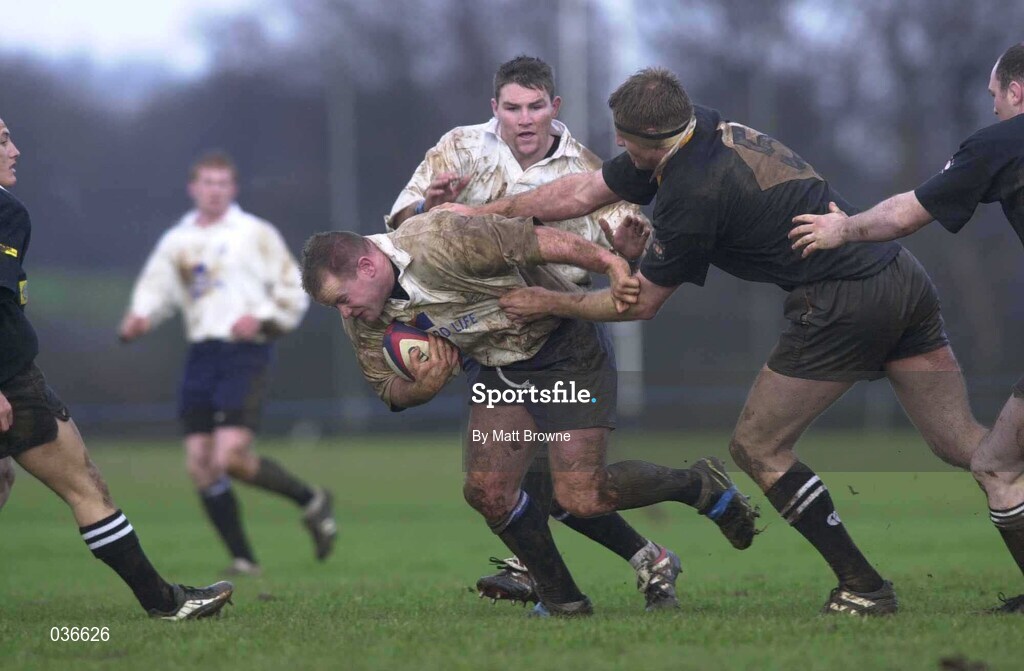 12 February 2000; Frank Sheahan of Cork Constitution is tackled by Gary Longhwell of Ballymena during the AIB League Division 1 match between Ballymena and Cork Constitution at Eaton Park in Ballymena, Antrim. Photo by Matt Browne/Sportsfile