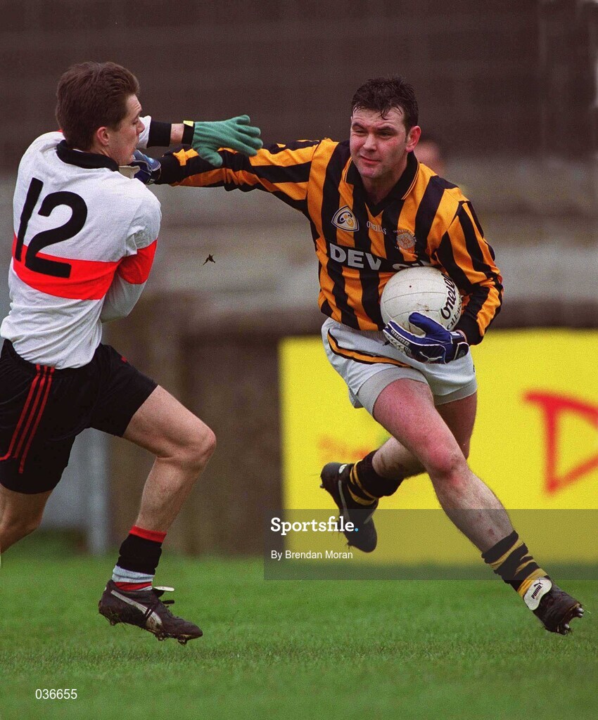 20 February 2000; Gary McShane of Crossmaglen is tackled by Keith Moran of UCC during the AIB All-Ireland Senior Club Football Championship Semi-Final match between Crossmaglen and UCC at Parnell Park in Dublin. Photo by Brendan Moran/Sportsfile