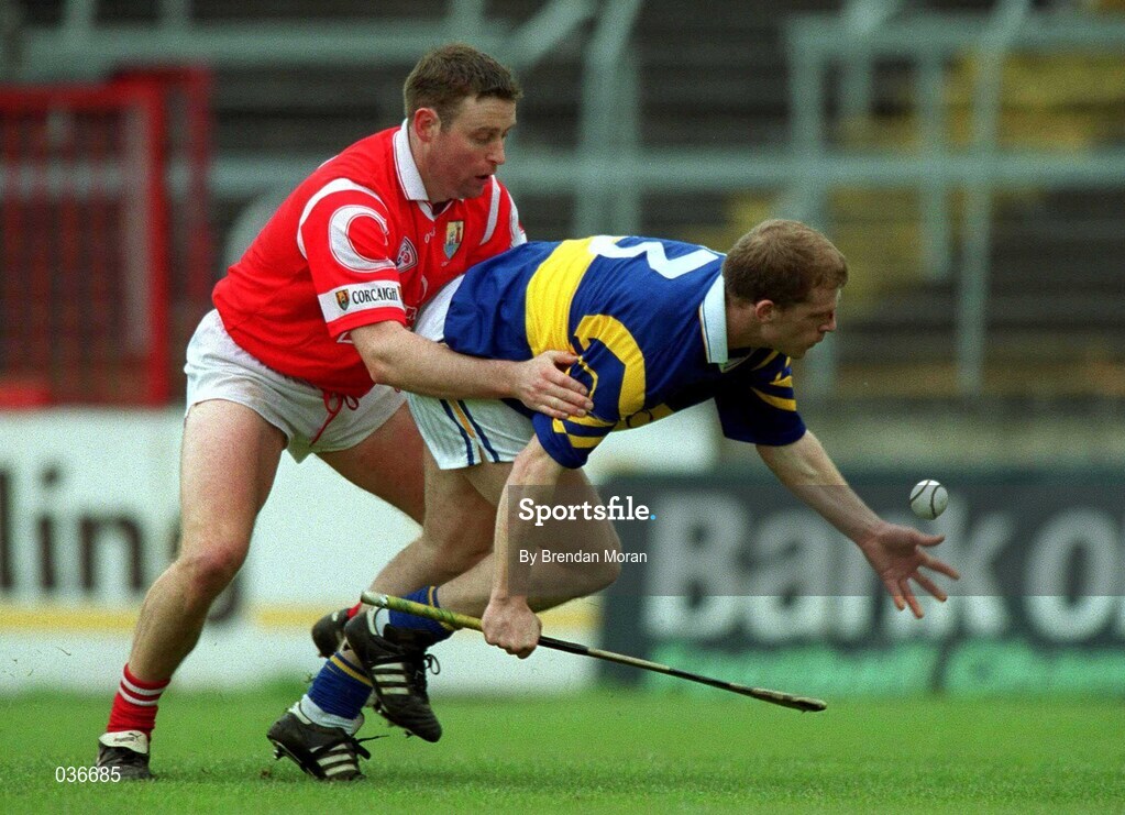 2 April 2000; Gerry Maguire of Tipperary in action against Fergal Ryan of Cork during the Church & General National Hurling League Division 1B match between Cork and Tipperary at Páirc Uí Chaoimh in Cork. Photo by Brendan Moran/Sportsfile