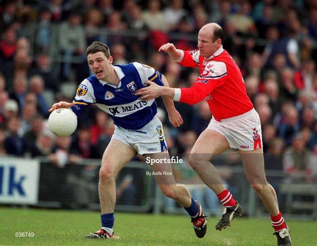23 April 2000; Ian Fitzgerald of Laois is tackled by Stephen Melia of Louth during the Church & General National Football League Division 2 Semi-Final match between Louth and Laois at Cusack Park in Mullingar, Westmeath. Photo by Aoife Rice/Sportsfile