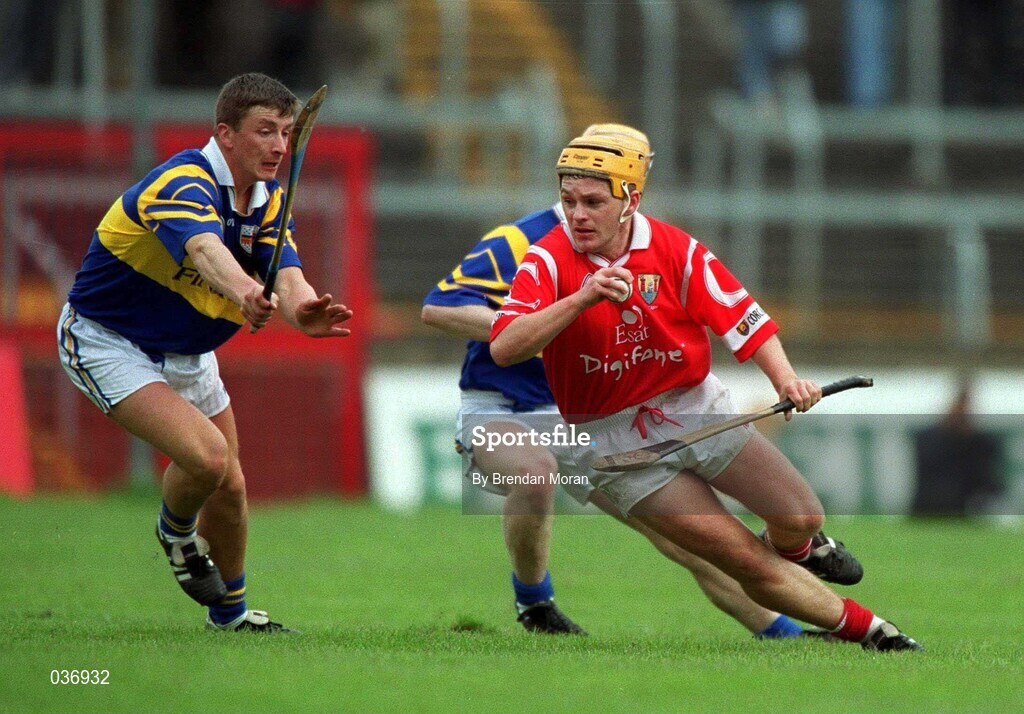 2 April 2000; Joe Deane of Cork in action against Noel Morris of Tipperary during the Church & General National Hurling League Division 1B match between Cork and Tipperary at Páirc Uí Chaoimh in Cork. Photo by Brendan Moran/Sportsfile