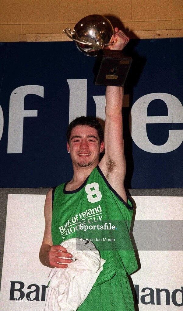 9 February 2000; The Colaiste Mhuire Crosshaven captain Jonathan Fitzgibbon lifts the trophy following the Bank of Ireland Schools Cup Boys' C Final match between Colaiste Mhuire Crosshaven and Carrick-On-Shannon CS at National Basketball Arena in Tallaght, Dublin. Photo by Brendan Moran/Sportsfile
