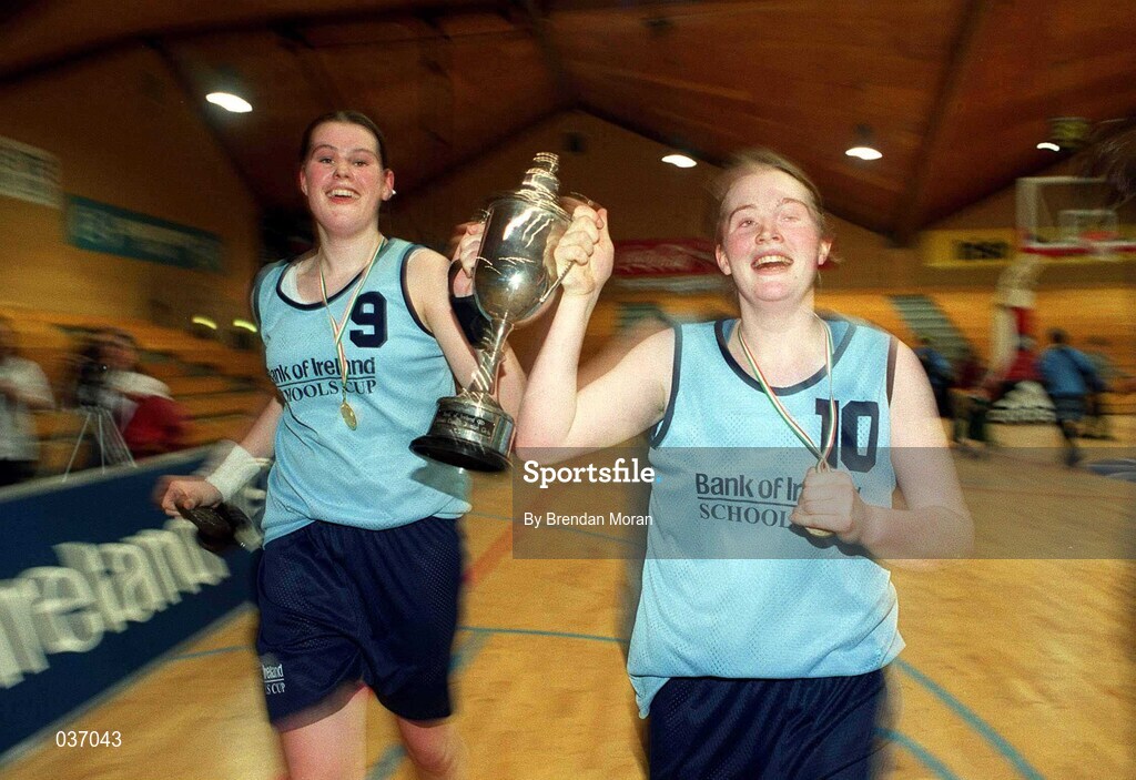 8 February 2000; Mercy Waterford co-captains Jenny Coady, right, and Kate Maher celebrate with the trophy following the Bank of Ireland Schools Cup Girls' A Final match between Mercy Waterford and Presentation Killarney at National Basketball Arena in Tallaght, Dublin. Photo by Brendan Moran/Sportsfile