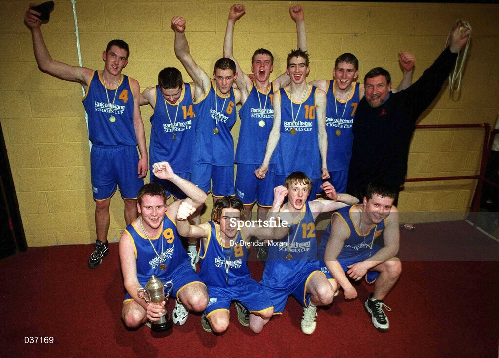 8 February 2000; St Laurence Loughlinstown players celebrate with the trophy following the Bank of Ireland Schools Cup Boys' B Final match between St Laurence Loughlinstown and St Mary's Moyderwel at National Basketball Arena in Tallaght, Dublin. Photo by Brendan Moran/Sportsfile